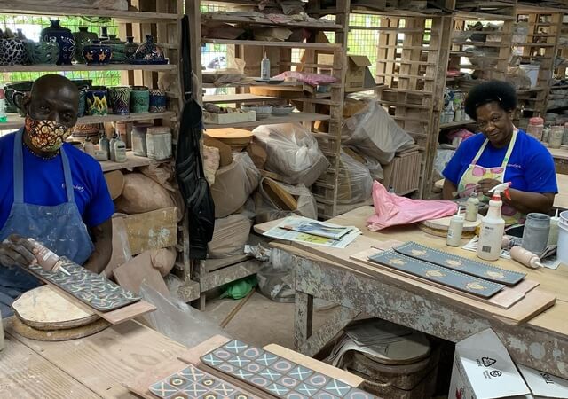 Hand decorating ceramics at Earthworks Pottery
