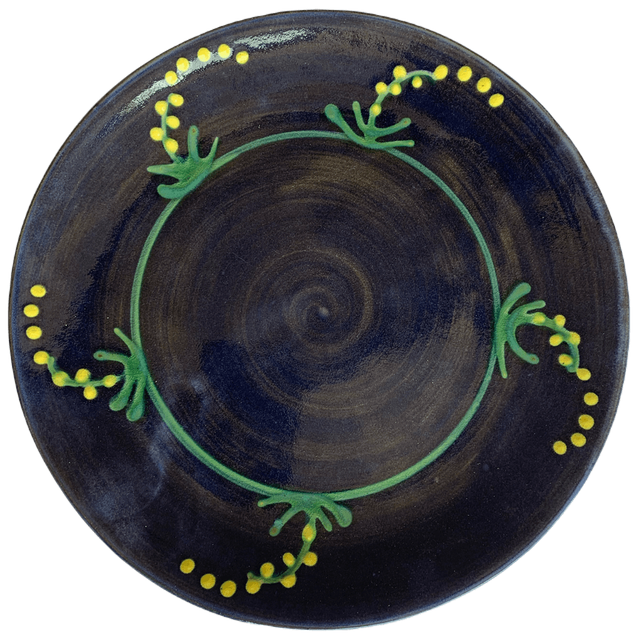 Round pottery pattern with blue background with yellow mimosa/cornflower design.
