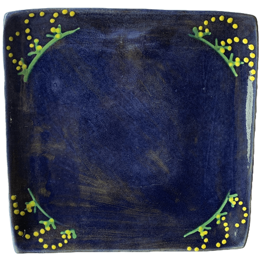 Pottery design with blue background with yellow mimosa/cornflower design.