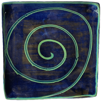 Square pottery design with blue background with green swirl.