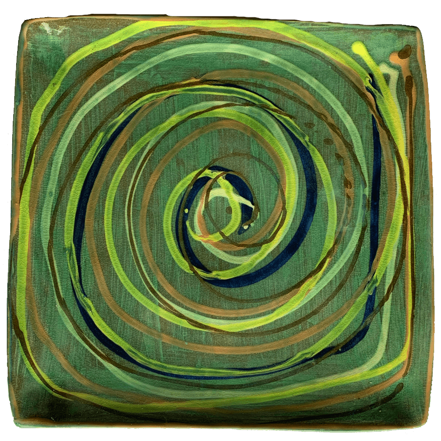 Ceramic pottery design with green background with many colors of swirls.